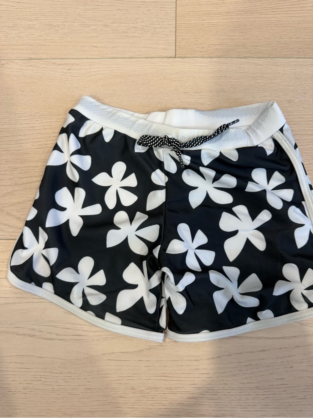 Of One Sea Kids Black & White Plumeria Floral Swim Trunks | 3-4T